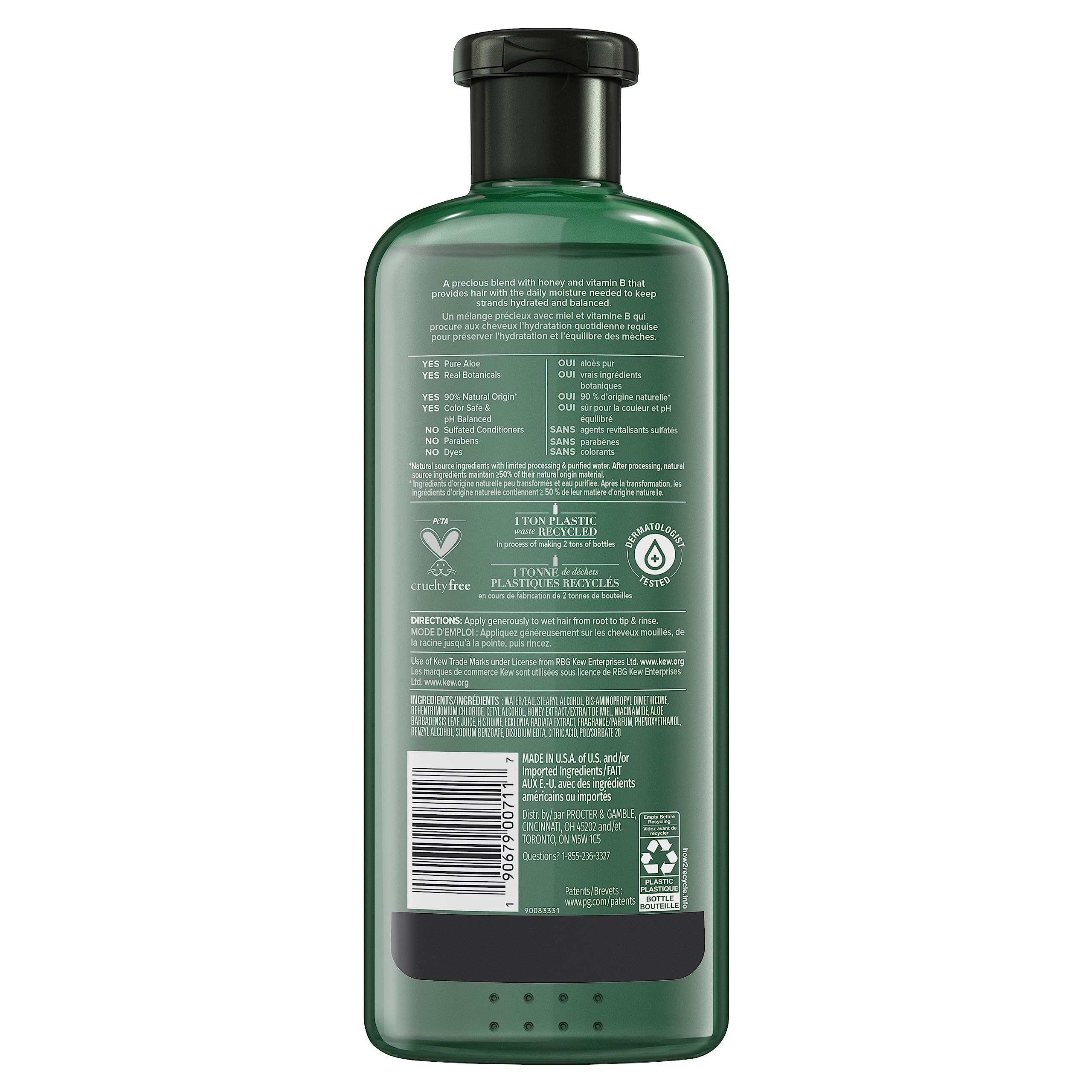 Creamy conditioner texture being applied to hair for smooth finish.