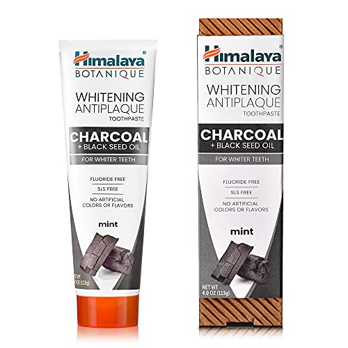 Close-up of toothpaste formula featuring coconut charcoal and black seed oil
