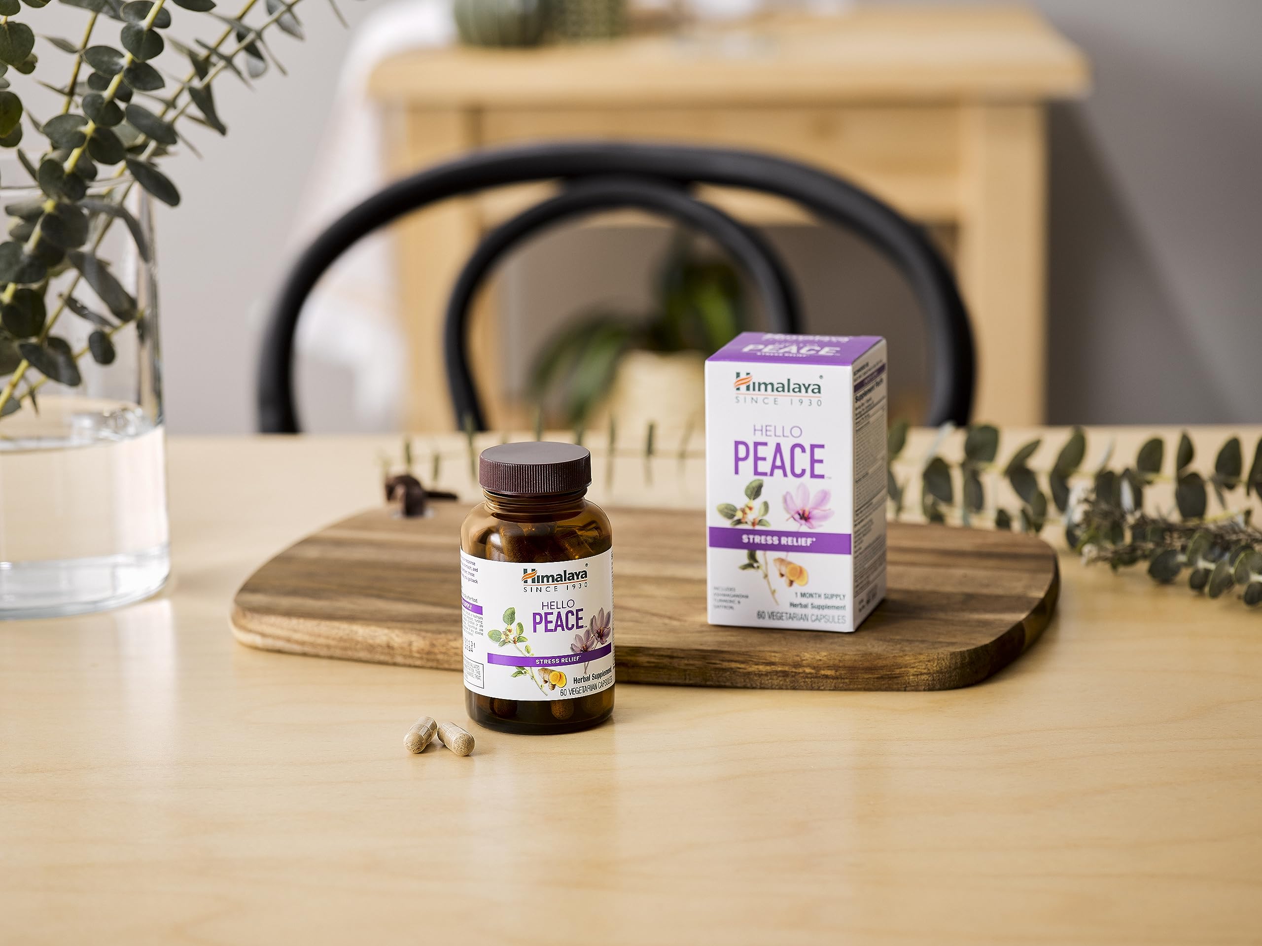 Packaging and bottle on wooden surface