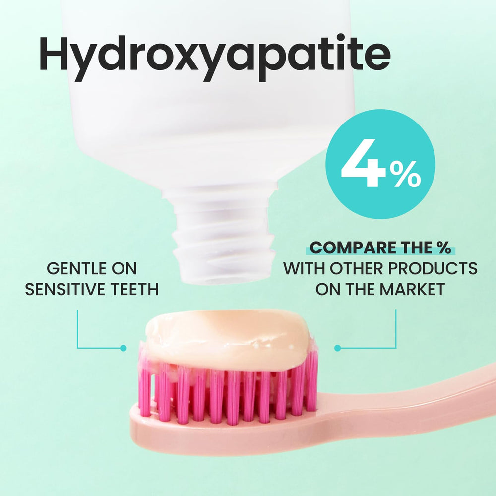 Close-up of toothpaste being dispensed onto a toothbrush
