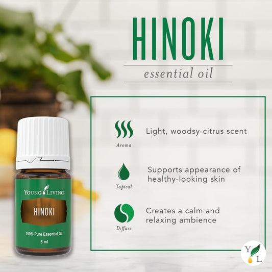 Young Living Hinoki essential oil diffuser at a work desk for focus.