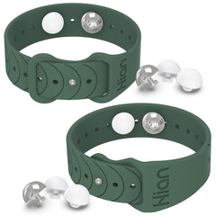 Hion motion sickness bands worn on the wrist in pine green may ease travel nausea