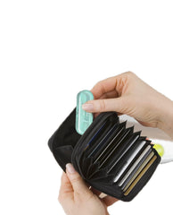 Open portable floss case showing 10-count floss sticks inside