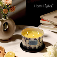 Soft ambient light from 4-wick soy candle on nightstand