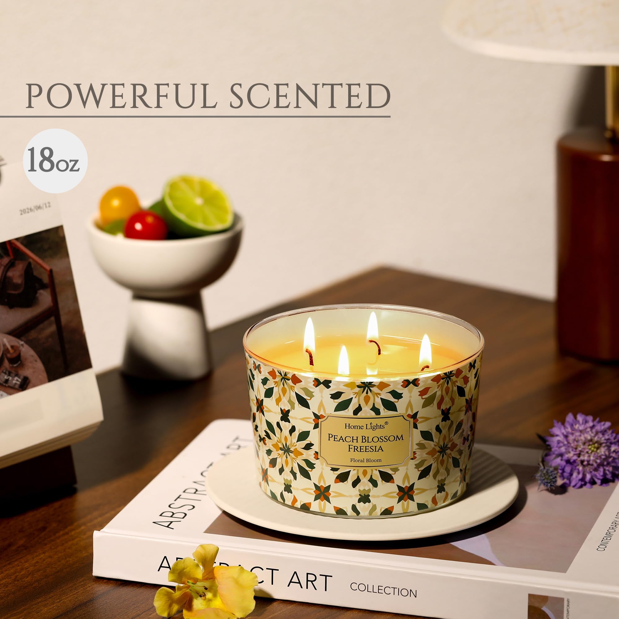 Close-up of HomeLights 18oz 4-wick candle displaying Peach Blossom Freesia scent