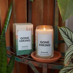 Close-up of the Gone Hiking candle label showing pine, jasmine and sandalwood notes