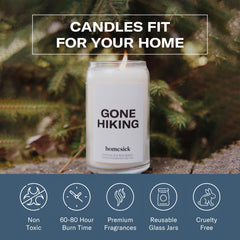 Lifestyle shot of the Gone Hiking candle in a cozy home setting