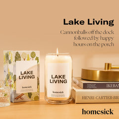 Homesick Lake Living candle lit on a porch with a lake view