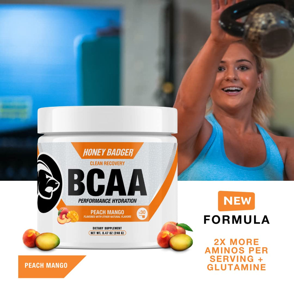 Close-up of Peach Mango BCAA + EAA powder being stirred in water