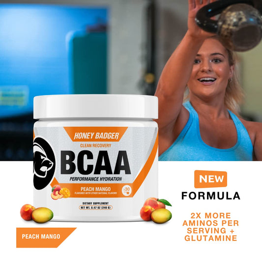 Close-up of Peach Mango BCAA + EAA powder being stirred in water