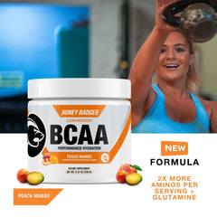 Close-up of Peach Mango BCAA + EAA powder being stirred in water