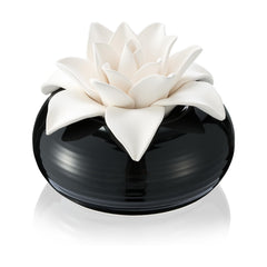 Honeydak white porcelain flower diffuser with ceramic rose top on a table