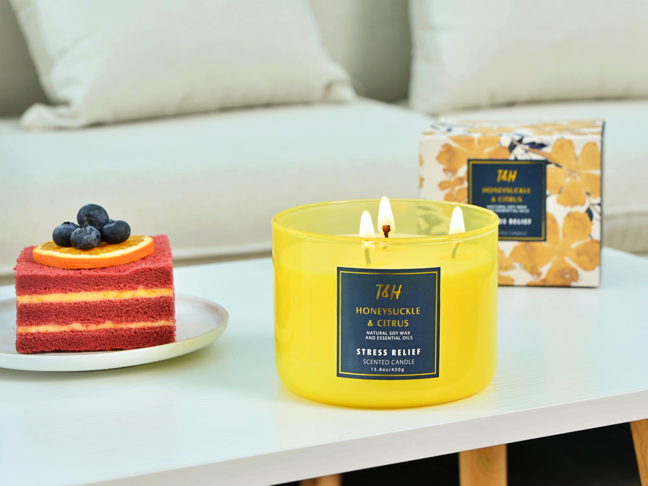 Gift-ready packaging and card beside the candle