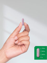 Beet root powder capsules spilled to show capsule color