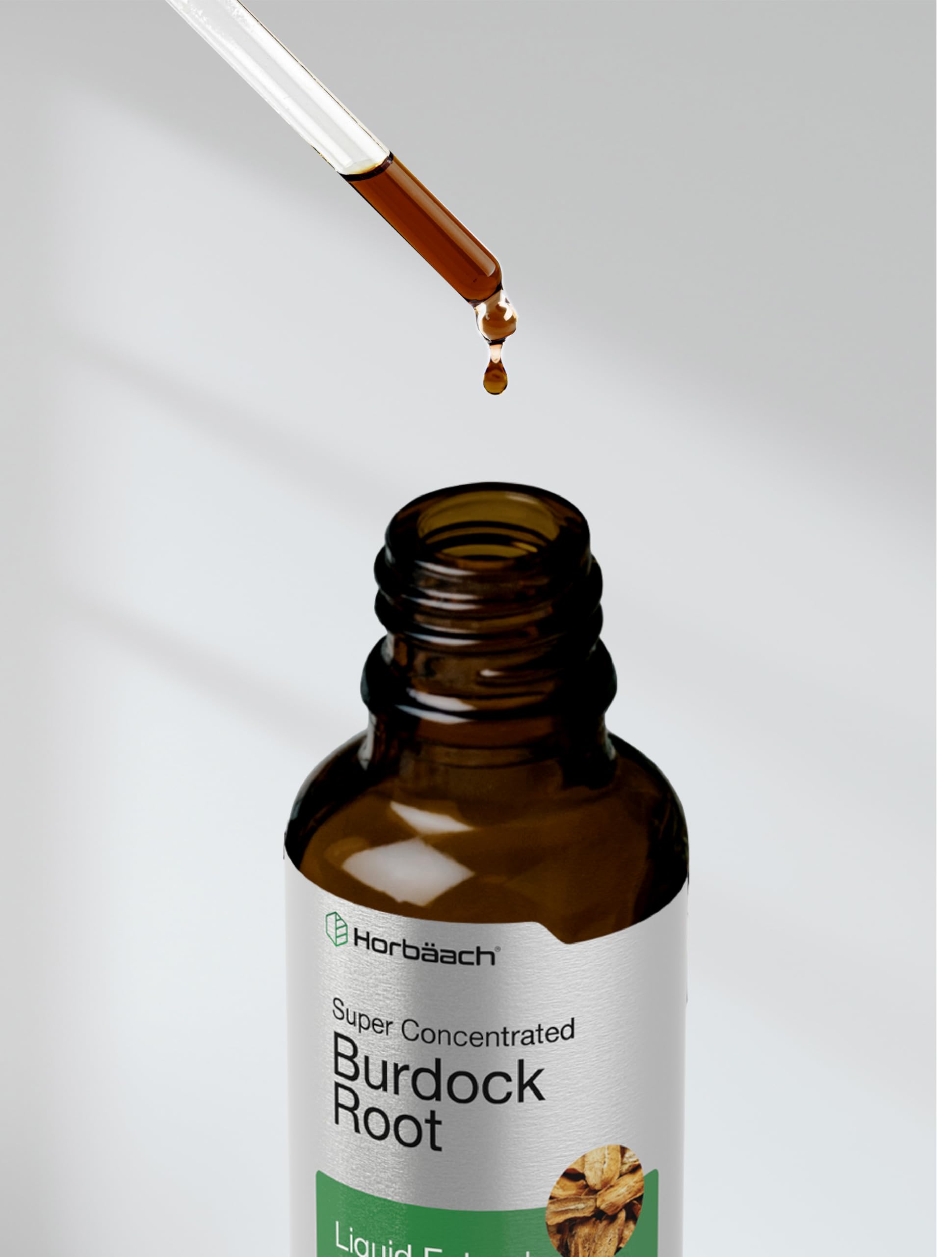 Bottle of Burdock Root Tincture with greenery in background