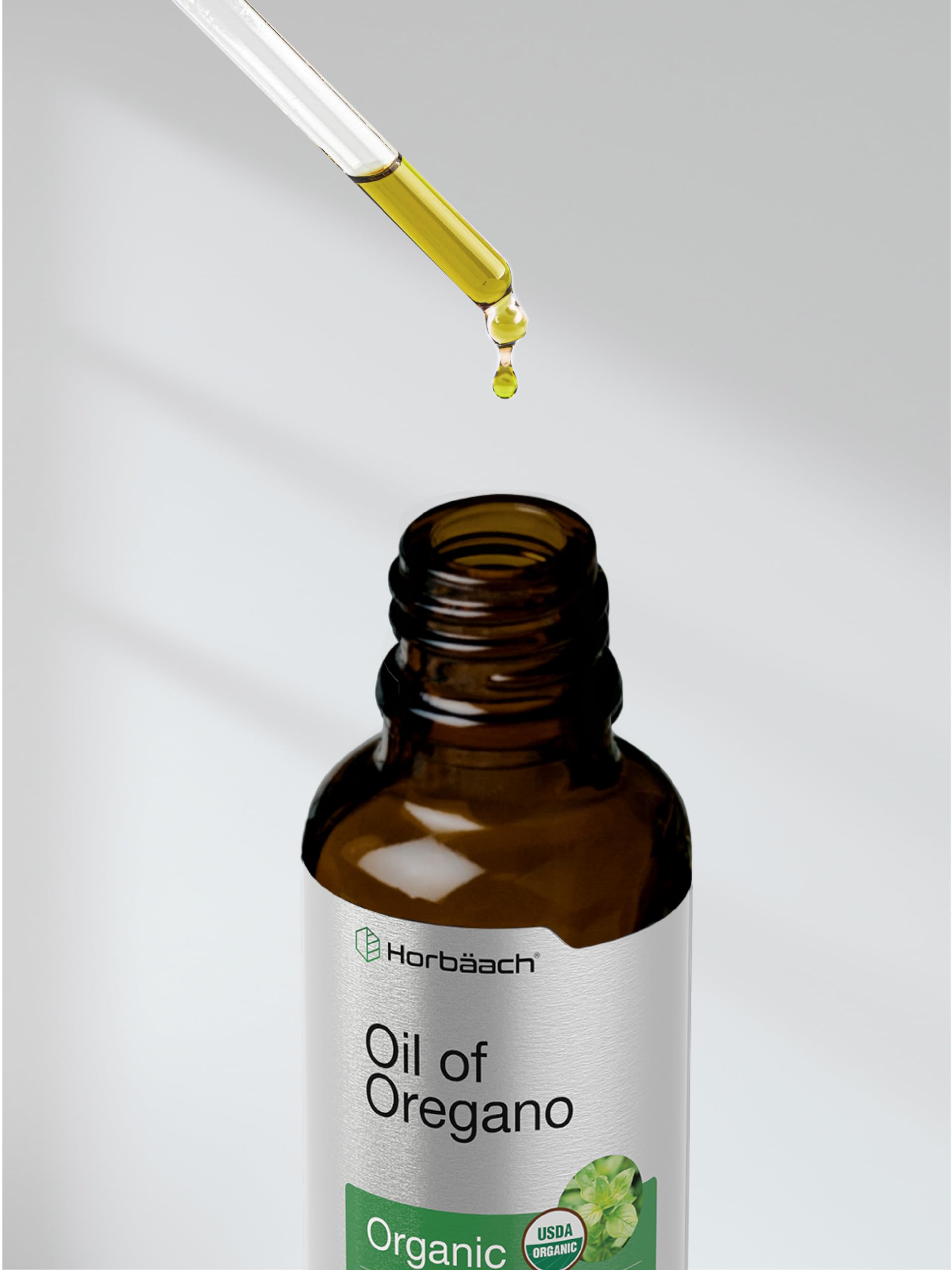 Usage illustration showing oregano oil drops