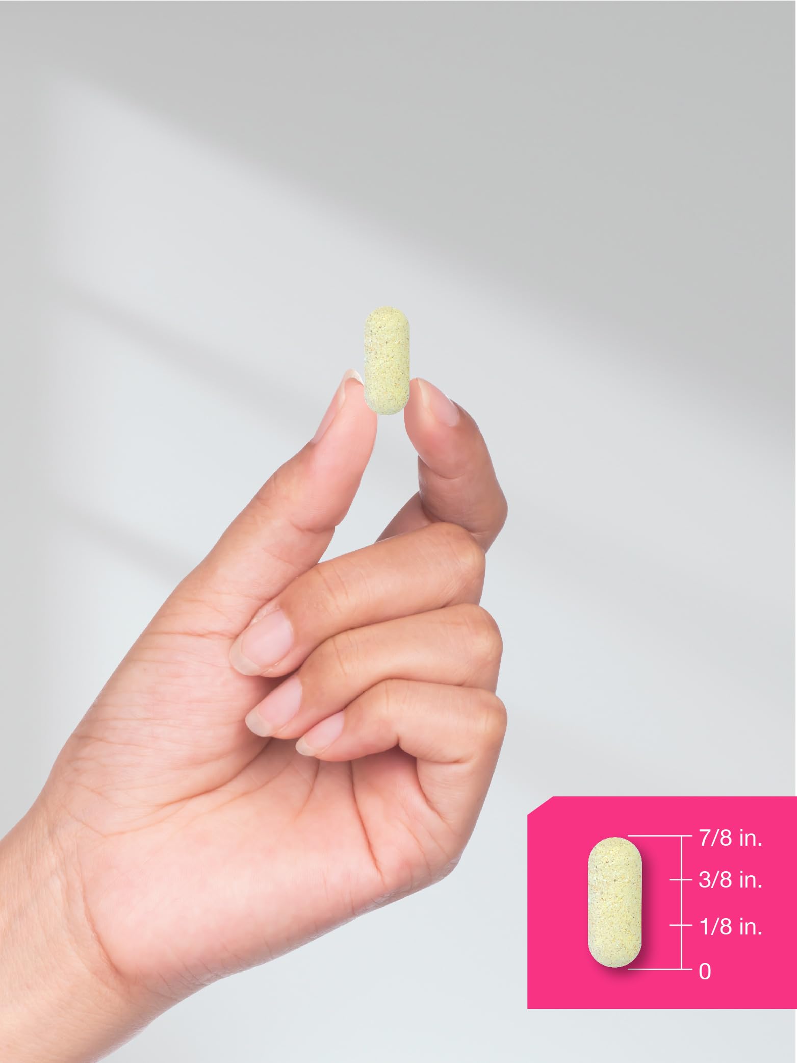 Product packaging and caplets arranged on white surface