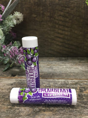 Close-up of the lip balm label showing all-natural ingredients for daily lip care.