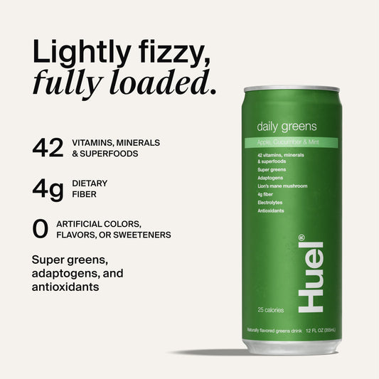 Huel Daily Greens bottle with fresh apples and cucumbers