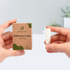 Reusable glass dispenser compatible with silk floss refills