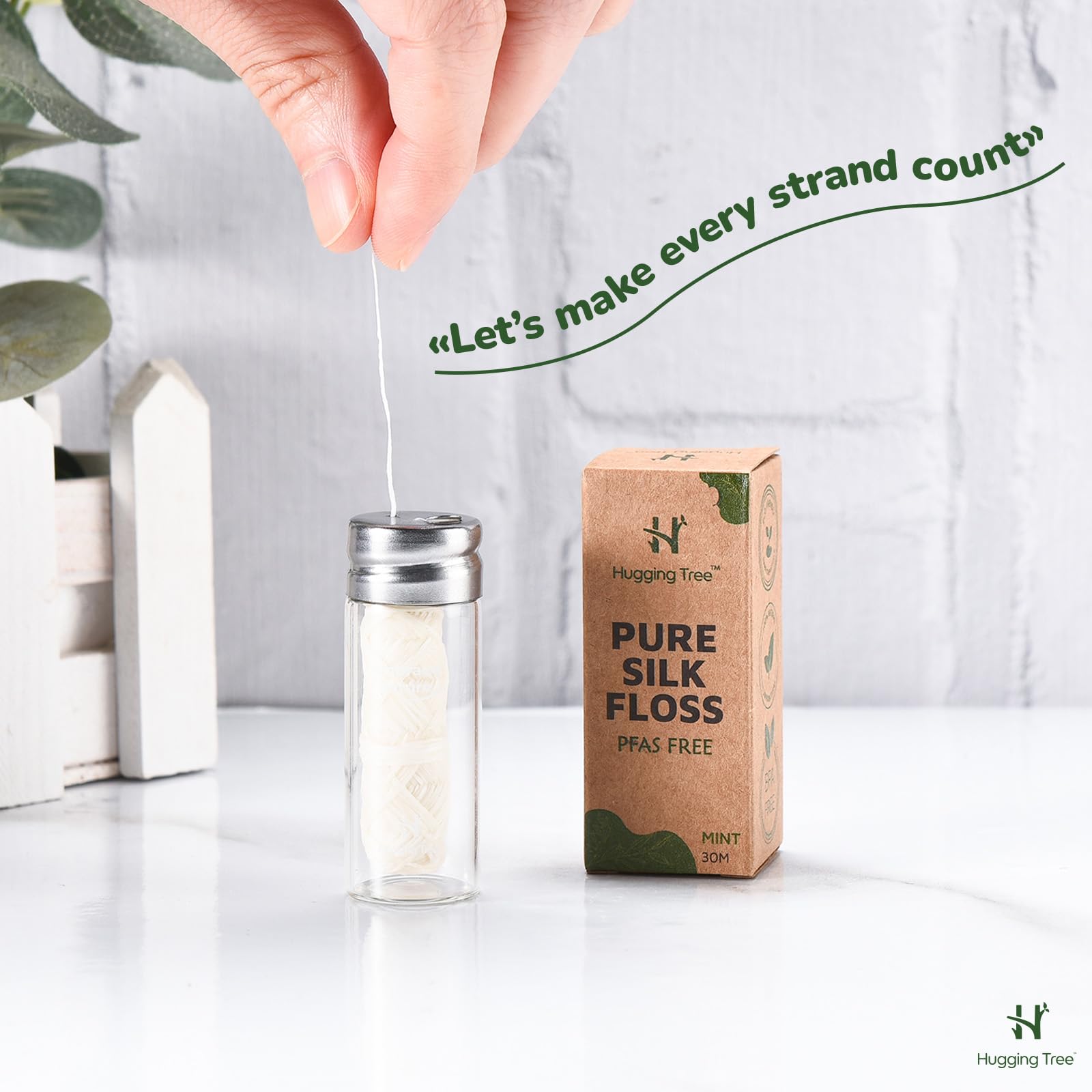 Reusable glass dispenser for Hugging Tree floss