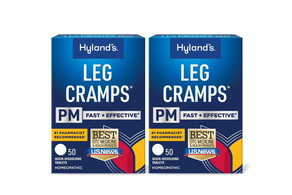 Hyland's Leg Cramps PM bottle on nightstand offering nighttime cramp relief