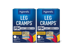 Hyland's Leg Cramps PM bottle on nightstand offering nighttime cramp relief