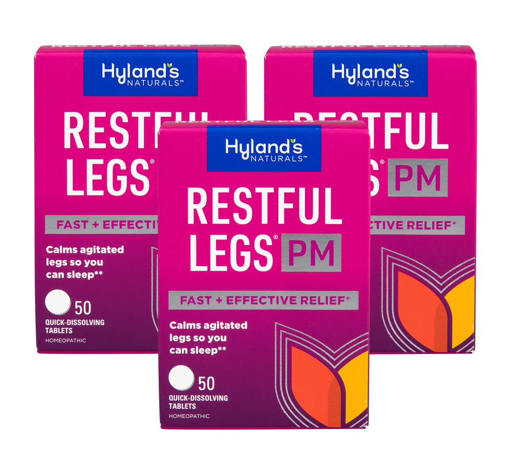 Hyland's Restful Legs PM tablet closeup shows gentle dissolving action for night use.