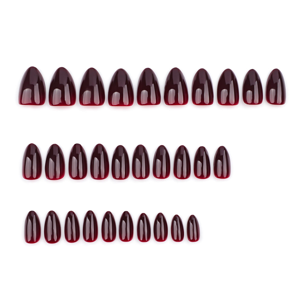 Close-up of Icebobo almond dark red nails for a natural tapered look