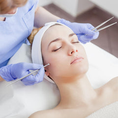 tool ready for reflexology massage on face