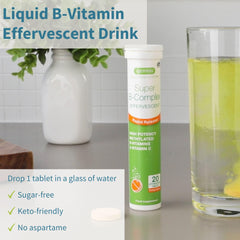 Dissolving B-vitamin effervescent tablet in a glass of water (orange flavor)