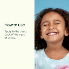 Applying Immune Boom Roll-On to the chest