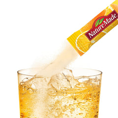 Orange-flavored Immunemax Fizzy Drink Mix being poured into a glass