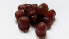 Assorted elderberry gummies with dark cherry flavor on white background