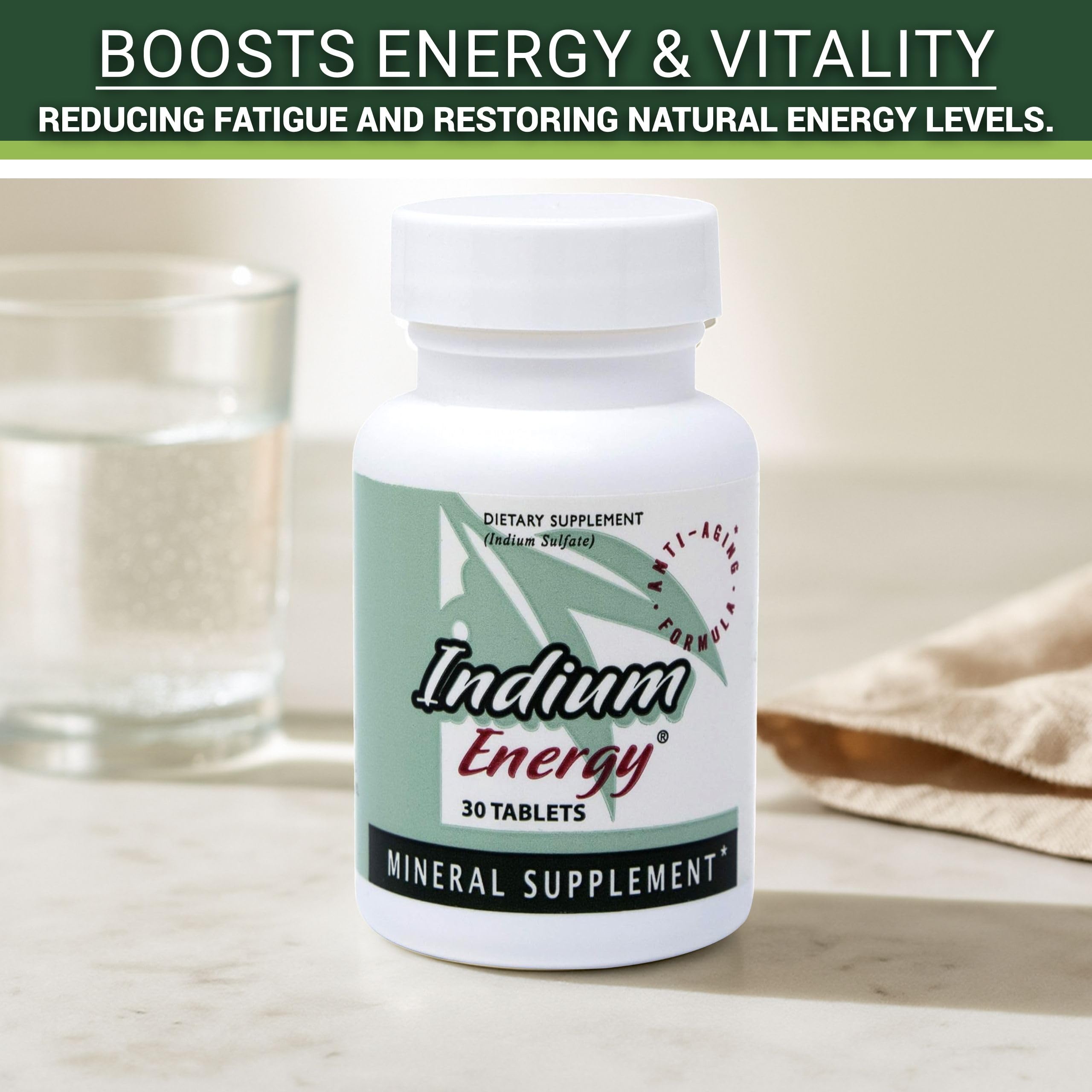 Lifestyle desk scene featuring Indium Energy bottle