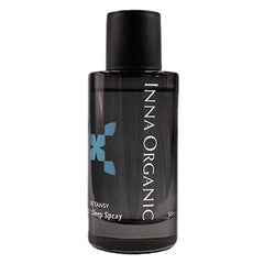 INNA ORGANIC Blue Tansy Sleep Spray bottle on nightstand promotes restful sleep.
