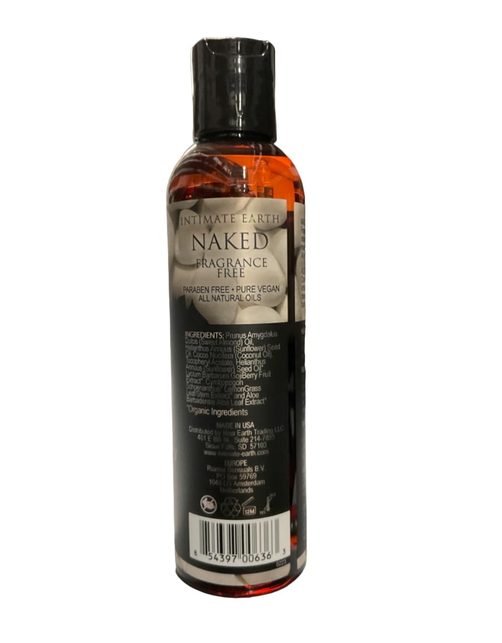 Close-up of the Naked Massage Oil label on the bottle
