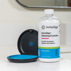 Aligners soaking in Cleaning Crystals+ solution