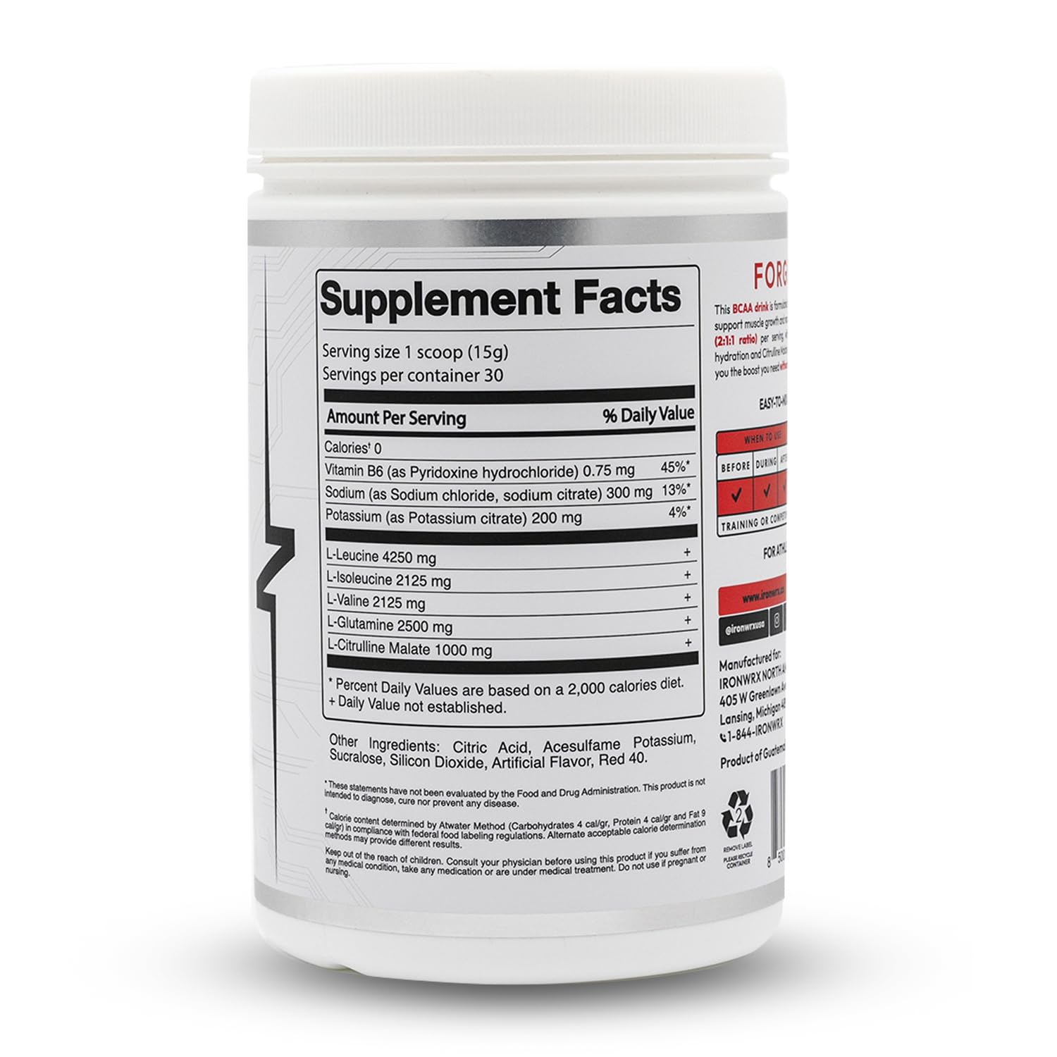 Serving scoop with BCAA powder next to a glass of water