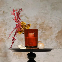 Close-up of laser-engraved metal lid on jar candle