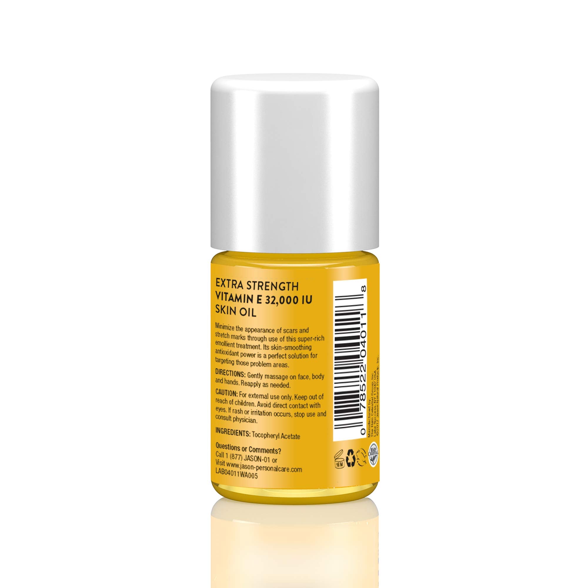 Hands applying JASON Vitamin E skin oil