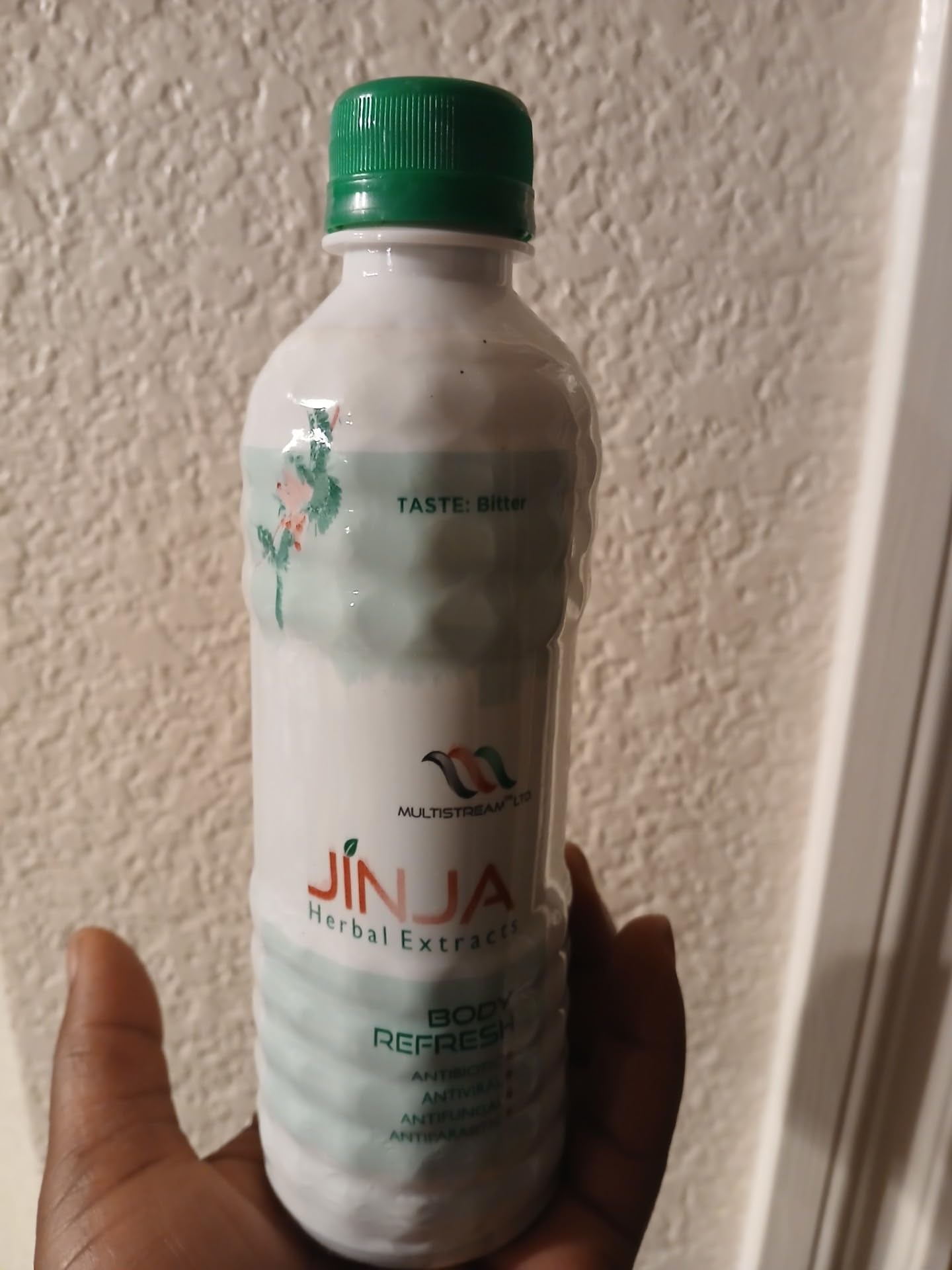 Close-up of Jinja Herbal Extract label