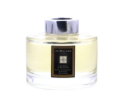 Close-up of diffuser bottle showing lime basil and mandarin notes