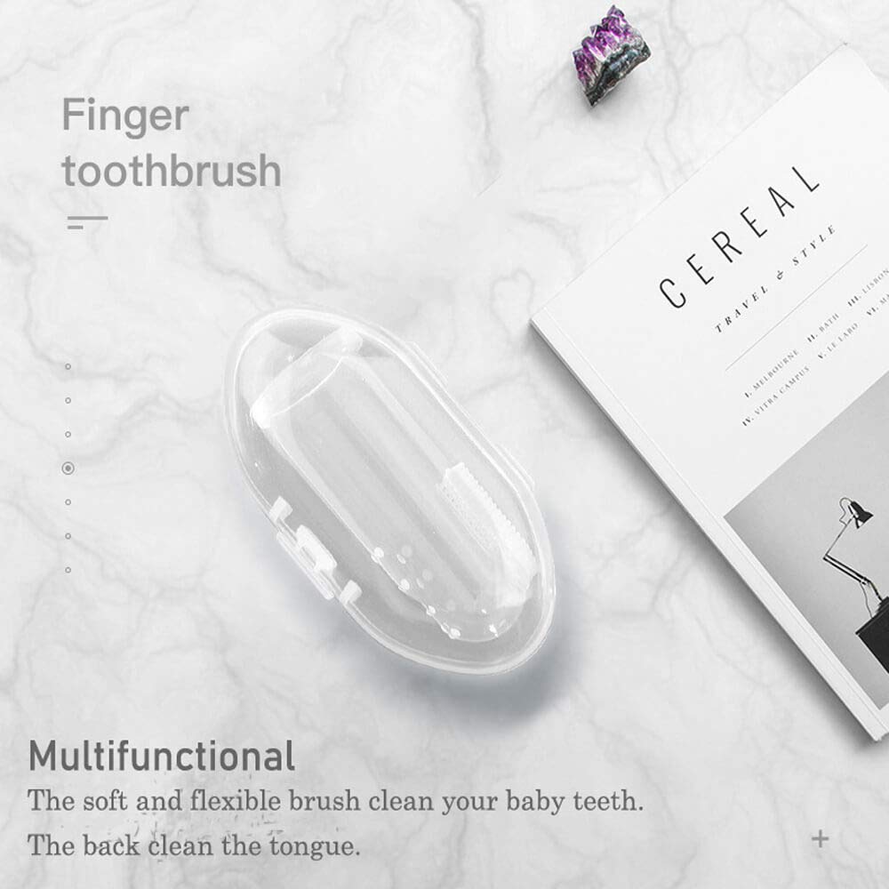 Infant wearing the wearable finger toothbrush to brush tiny teeth