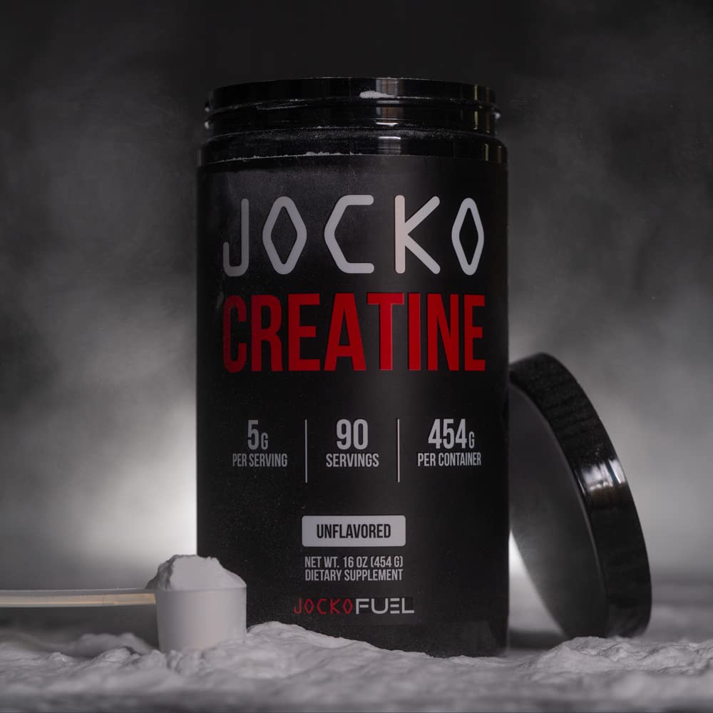Jocko Fuel Creatine Monohydrate being stirred in a glass for quick hydration.