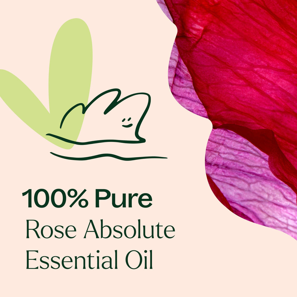Carrier oil jojoba beside Rose Absolute essential oil