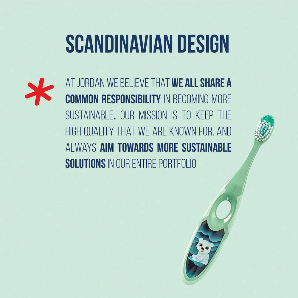 Jordan* toothbrush beside a child’s hand showing appropriate size