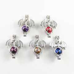 Julie Wang dragon pendant charm; ready for DIY aromatherapy jewelry making.