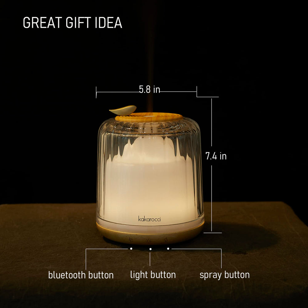 Close-up of glass dome and wood base on Kakoda essential oil diffuser