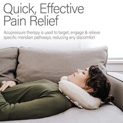 Pillow with carry bag placed beside travel essentials